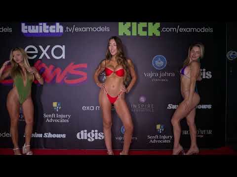 Exa Models pose for photographers on the red carpet at Exa Shows Art Basel Miami