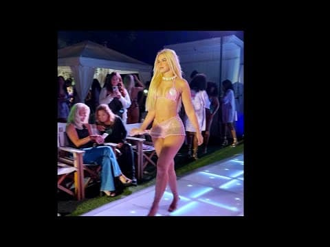 Karen Rodriguez walking and posing on runway before Exa Models Art Basel Event